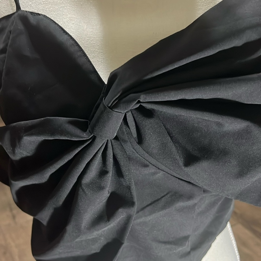spaghetti strap with large bow across the chest adjustable straps